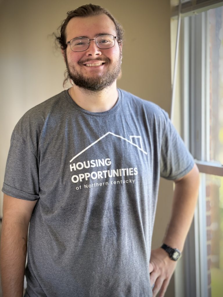 Joe Snavely stands next to a window as he works to rehab a home with Housing Opportunities of Northern Kentucky