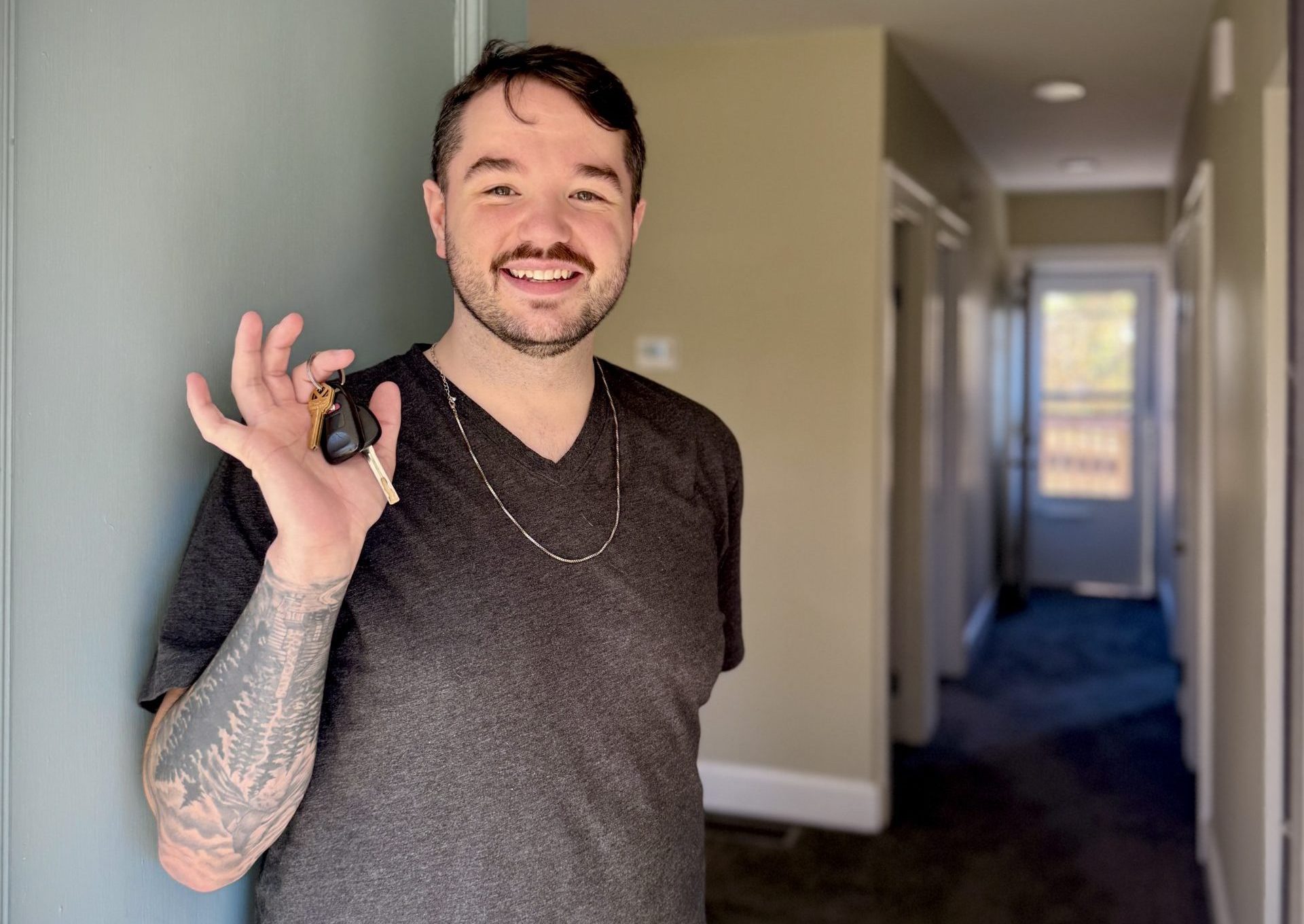 Aryn holds the keys to his new Elsmere home on move-in day. This first-time homebuyer plans to buy this house as his first house in Northern Kentucky through HONK's lease-to-own program.